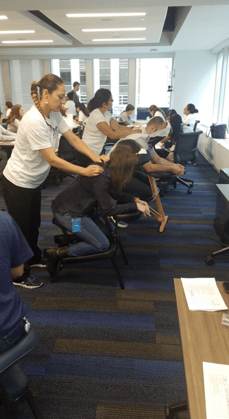 Corporate chair massage in NYC for stress relief at work