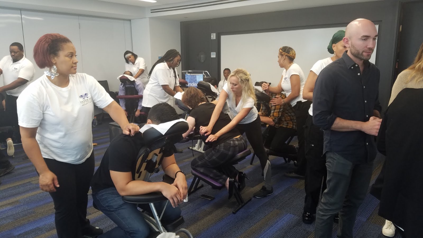 Workplace corporate chair massage in NYC improving productivity