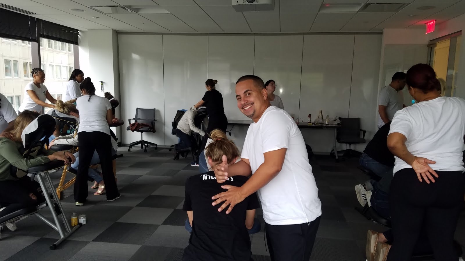 Corporate chair massage services in NYC workplace